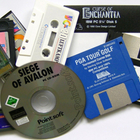 Photo of a pile of old media formats, including CDs, floppy disks, GameBoy cartridges, and cassette tapes.